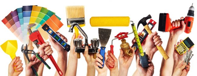 Hands with construction tools.